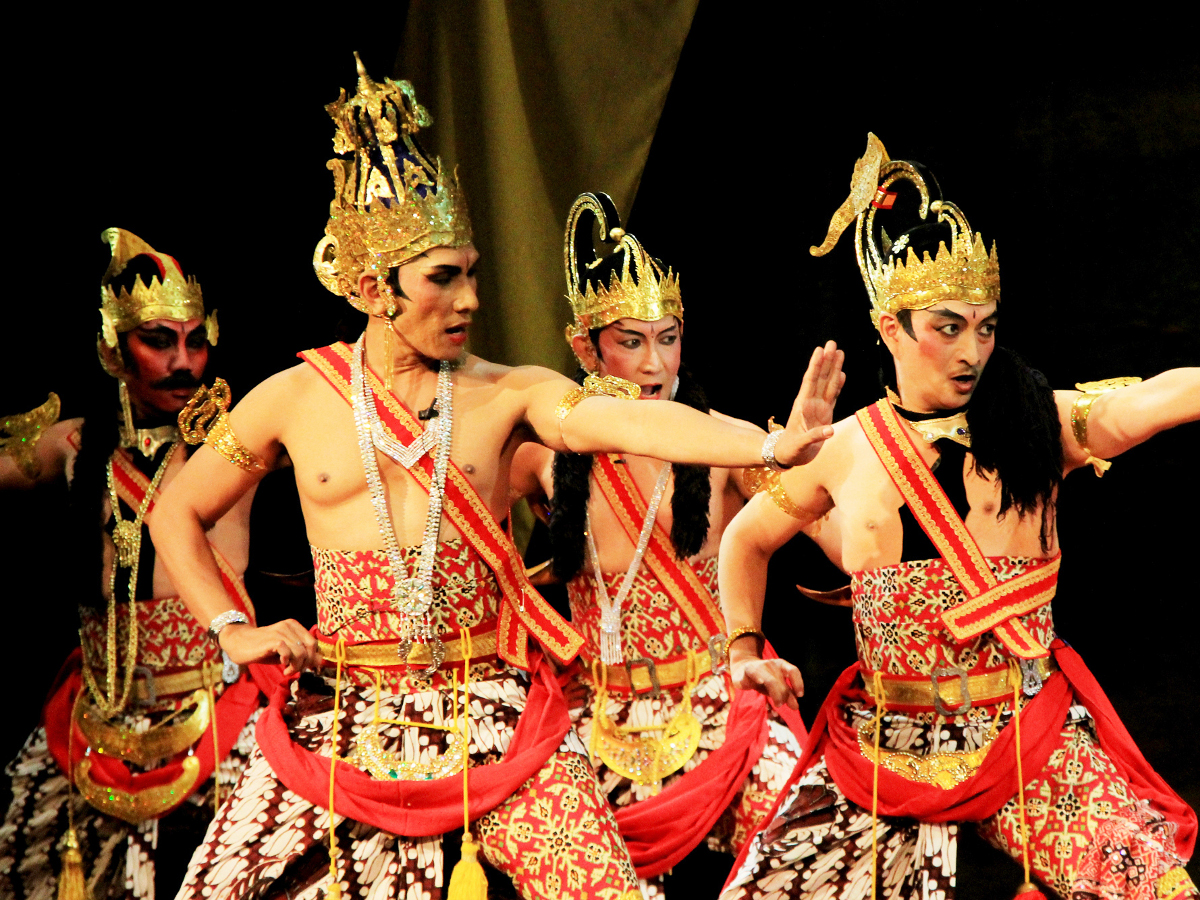  Five male dancers in golden headdresses and traditional Javanese dance costumes perform the Keong Mas legend in a Wayang orang performance.